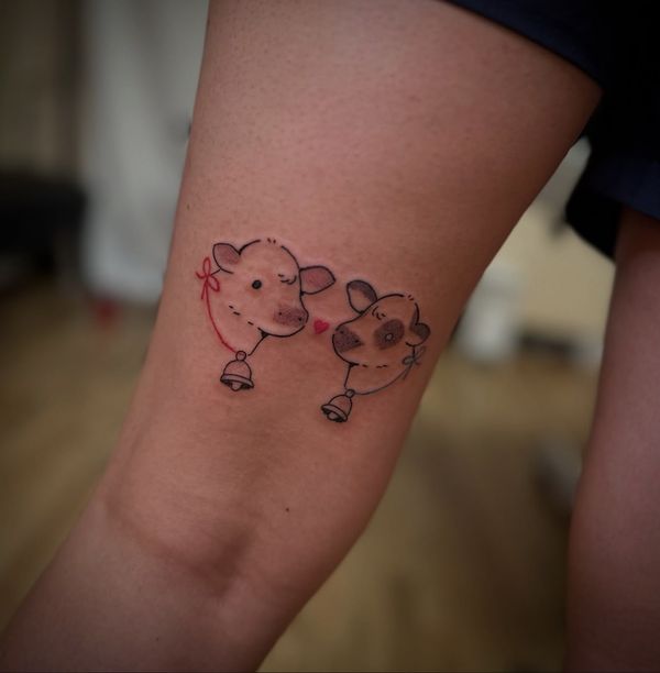 Mini cow flash tattoo by LoLo, on the back of the arm