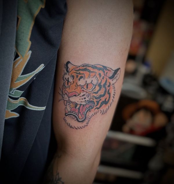 Japanese tiger tattoo by LoLo, on the forearm