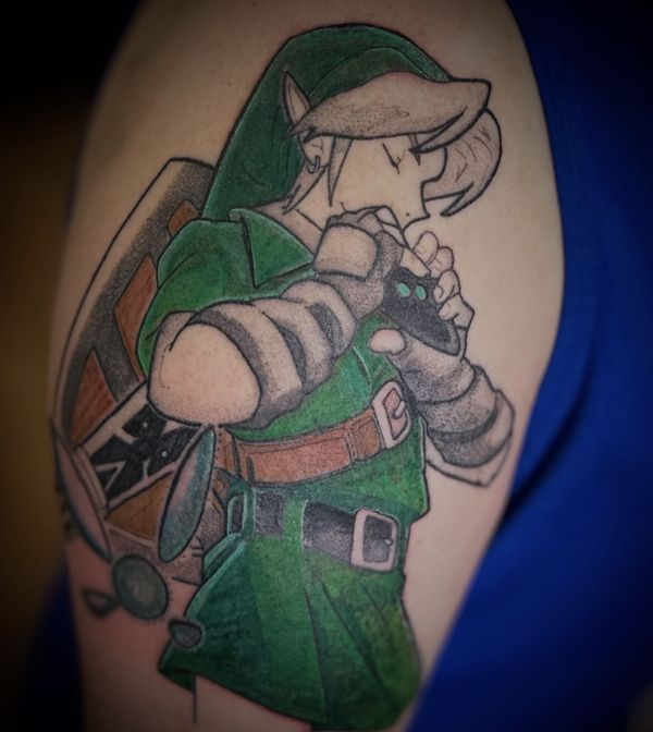 Legend of Zelda tattoo by LoLo, on the upper arm