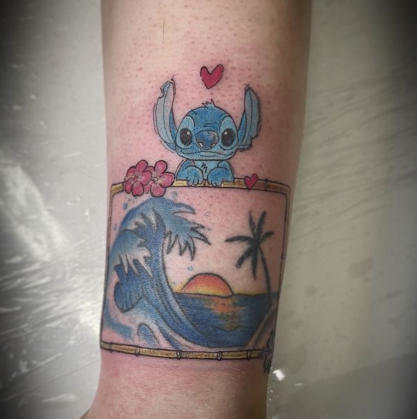 Lilo and Stitch custom tattoo by LoLo, on the forearm